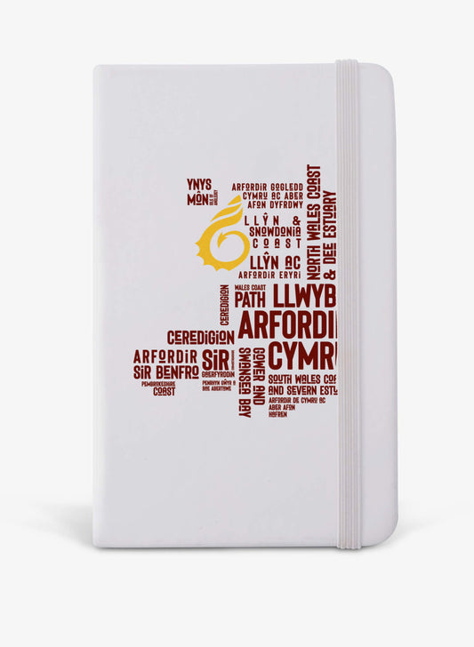 White A5 notebook featuring place names from the Wales Coast Path.